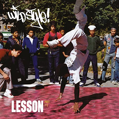 Record cover: breakdancer in mid-air, surrounded by onlookers in a city.