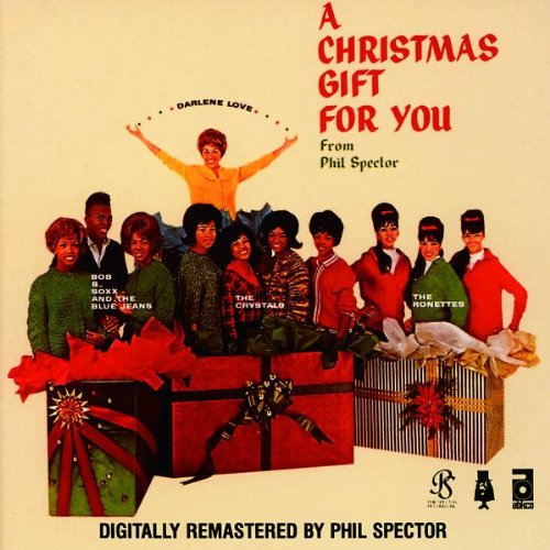 Album cover for "A Christmas Gift For You" featuring a group and gifts.