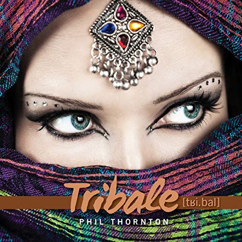Close-up of eyes with ornate forehead jewelry, album cover for "Tribale.