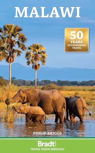 Book cover showing elephants in water with palm trees and mountains in the background.