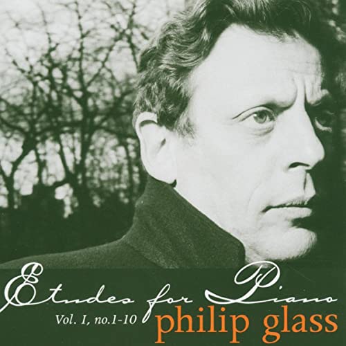 Philip Glass album cover featuring a portrait and bare tree branches.