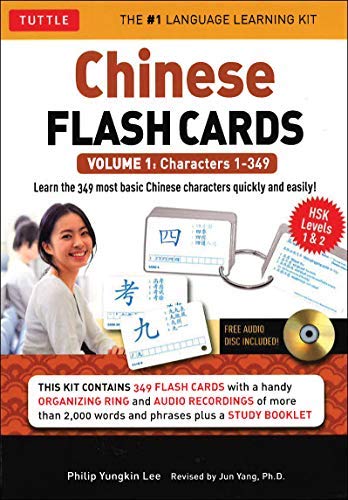 A smiling woman next to Chinese flashcards on a ring and an audio disc.