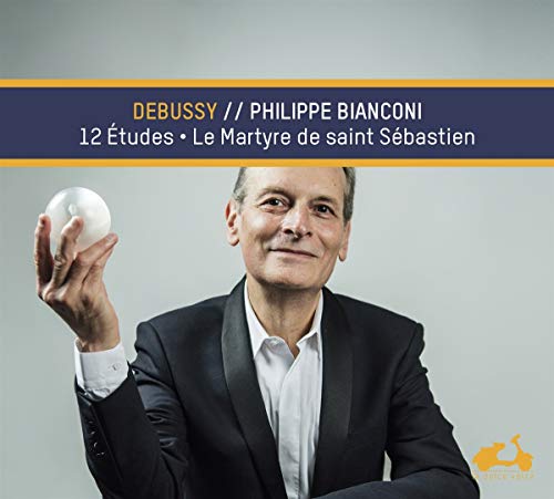 Portrait of pianist Philippe Bianconi with a white sphere in hand.