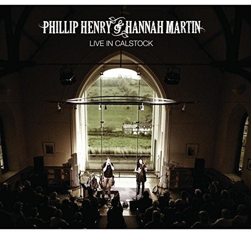 "CD cover featuring musicians performing on stage in a church with a crowd."