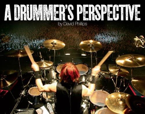 Drummer playing on stage, seen from behind, with blurred crowd.