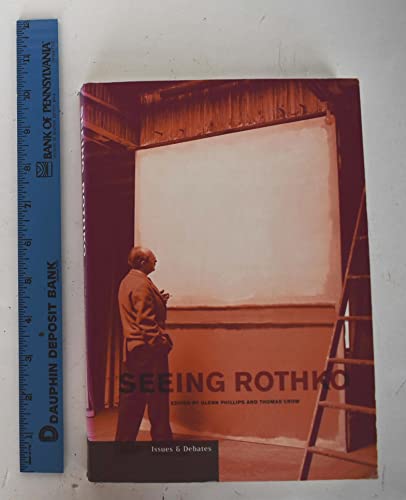 Book cover showing a man standing before a large white canvas in a studio.