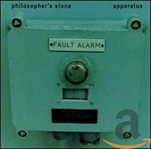 Teal control panel with a central knob and “FAULT ALARM” text.