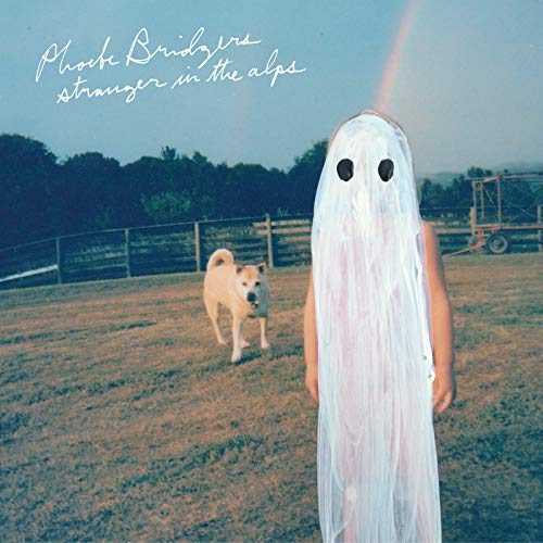 Album cover: figure in a sheet with a dog in a field.