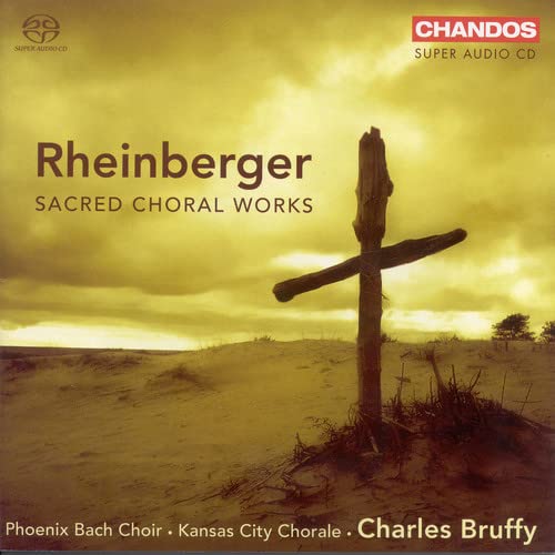 CD cover with a rustic cross against a golden, cloudy sky.