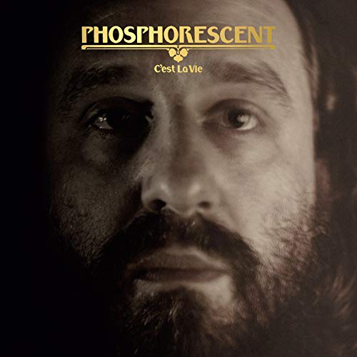 Album cover for Phosphorescent’s “C’est La Vie” featuring a man’s portrait.