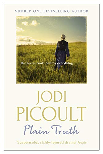 Book cover: woman in dark dress walking through a green field.