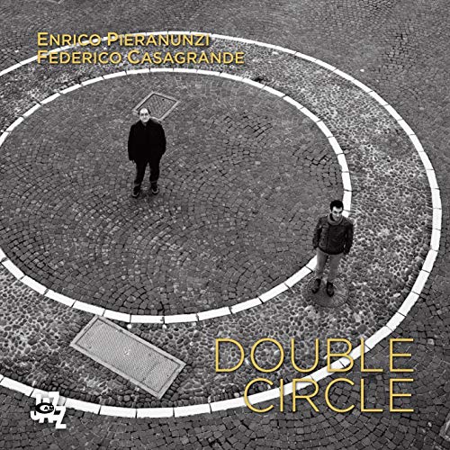 CD cover: two figures within concentric circles on a tiled ground.