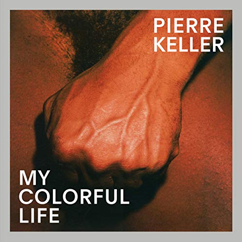 Book cover: close-up of a clenched fist, red background, text “Pierre Keller”.