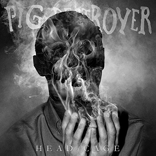 Album cover for Pig Destroyer’s “Head Cage” featuring a smoky, distorted face.