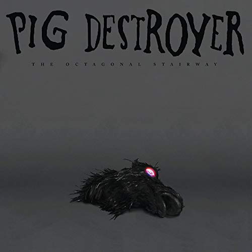 "Vinyl album cover with a pig's head and glowing red eye."
