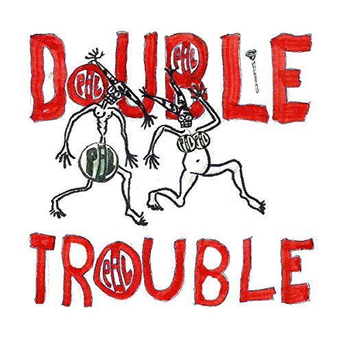 Album cover for Pil's "Double Trouble" featuring cartoonish figures.