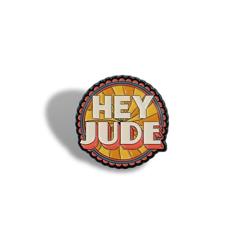 Round pin badge with “Hey Jude” text in orange and yellow.