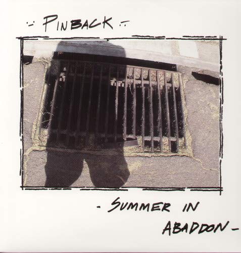 Vinyl record cover with a black and white photo of a sewer grate.