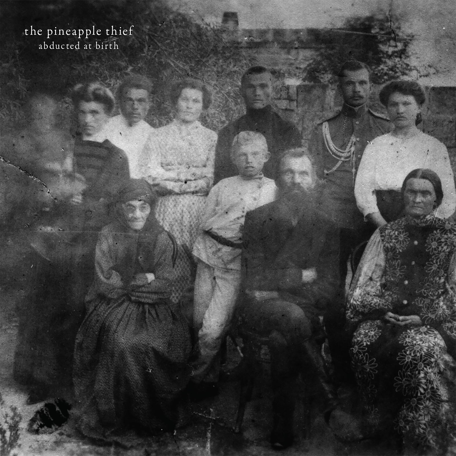 CD cover: grainy, vintage photo of a large group of people.