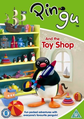 Pingu holding a rocket, surrounded by toys in a shop setting.