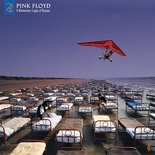 Album cover: Pink Floyd’s “Momentary Lapse Of Reason” with a hang glider and beds.