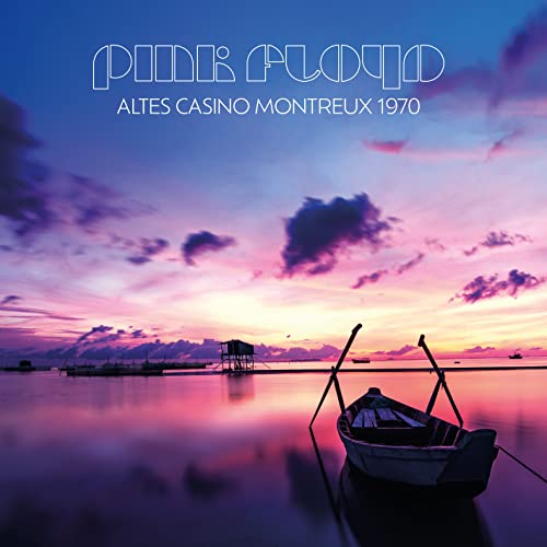 Pink Floyd album cover: sunset over water with boats and a pier.