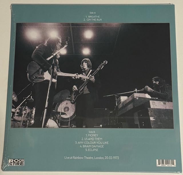 Pink Floyd album cover featuring musicians performing on stage in black and white.