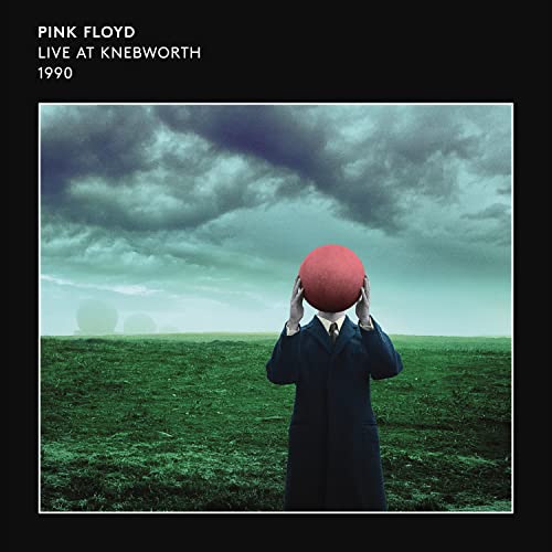 Pink Floyd album cover: man holding a red sphere against a cloudy sky.