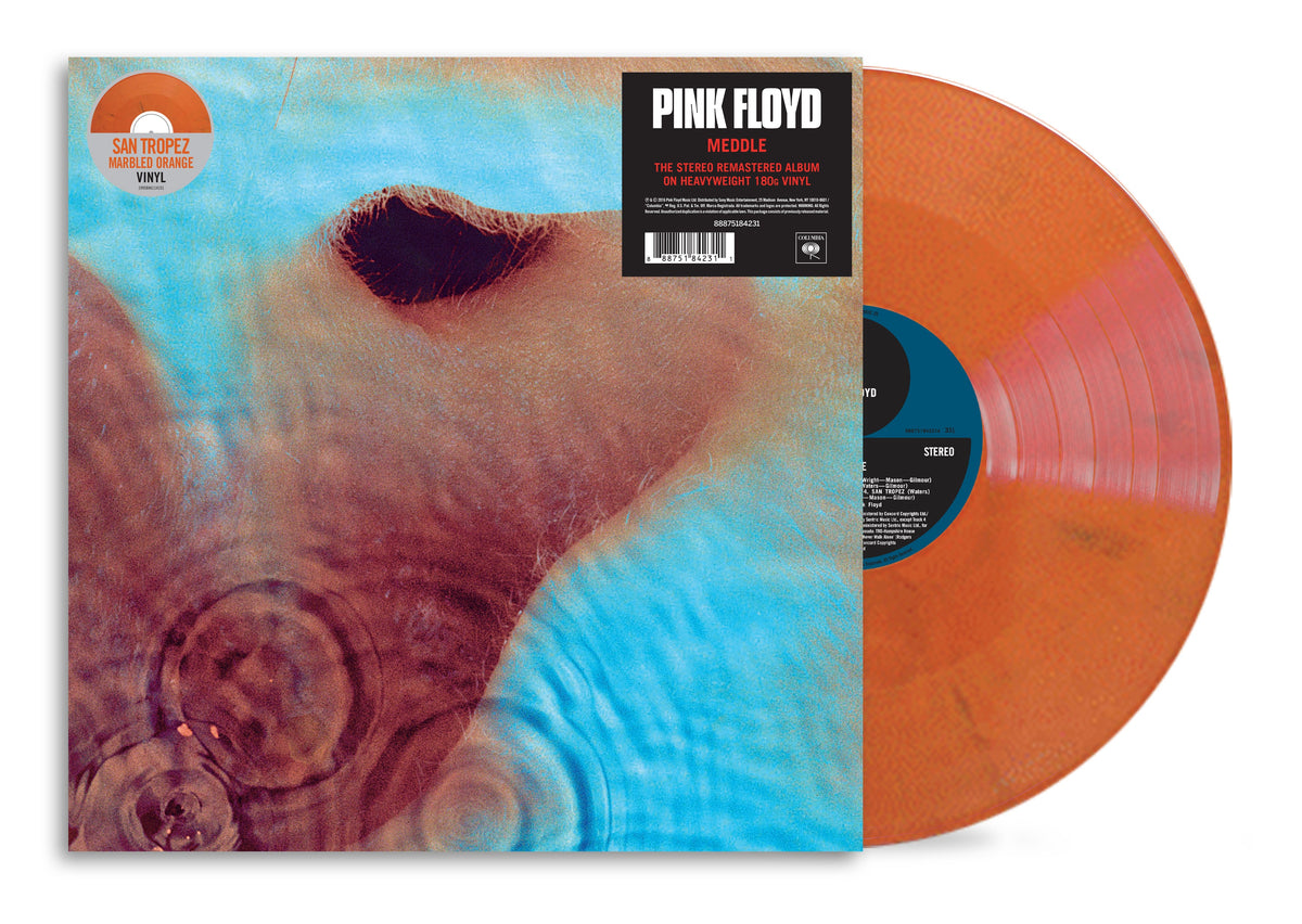 Pink Floyd’s “Meddle” vinyl record, featuring a face and orange disc.