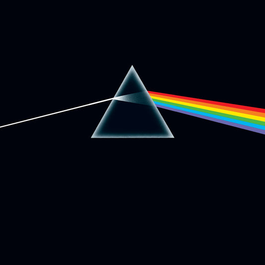 A white light beam enters a glass prism and exits as a rainbow spectrum.