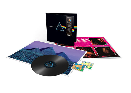 Pink Floyd The Dark Side of the Moon vinyl record set with inserts and posters.