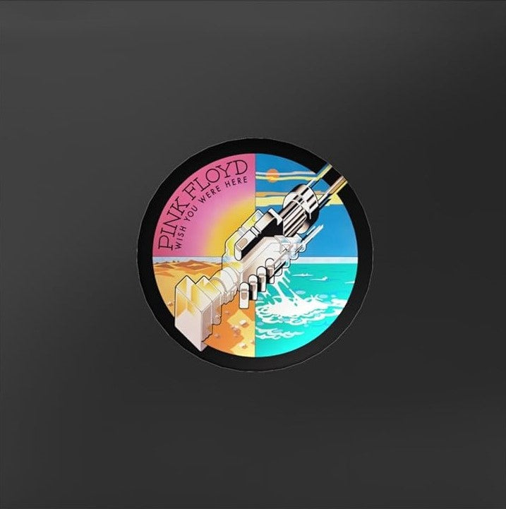 Pink Floyd’s “Wish You Were Here” album cover with shaking hands.