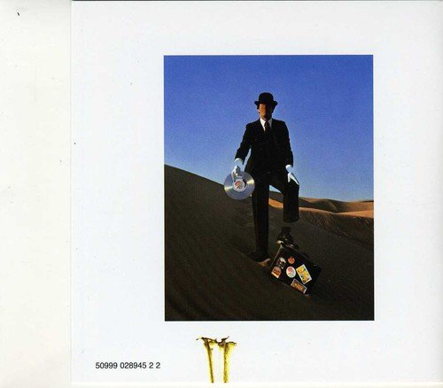 "Album cover of Pink Floyd's 'Wish You Were Here' showing two men shaking hands."