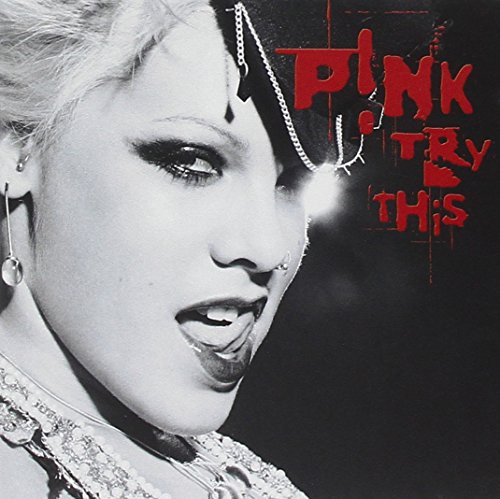 Close-up of Pink with red text “TRY THIS” on a black and white album cover.
