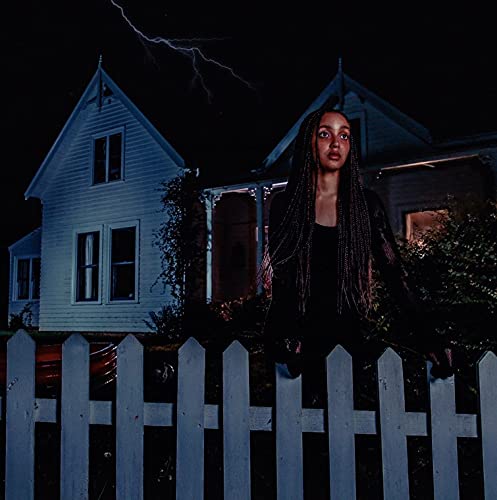PinkPantheress album cover: woman by a house during a thunderstorm.