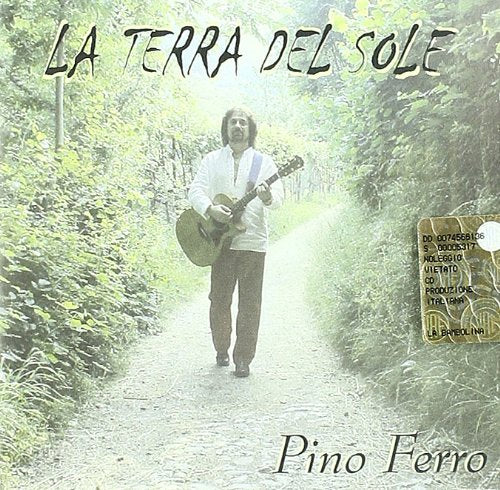 CD cover: man with guitar walking down a country road.