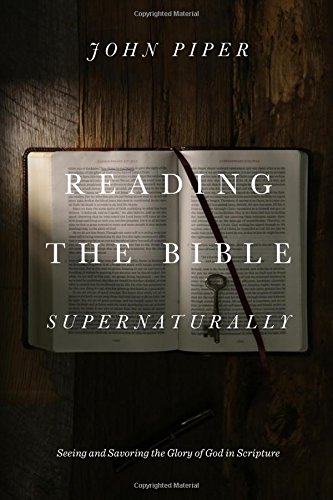 Open book with a key on the pages, titled "Reading the Bible Supernaturally.