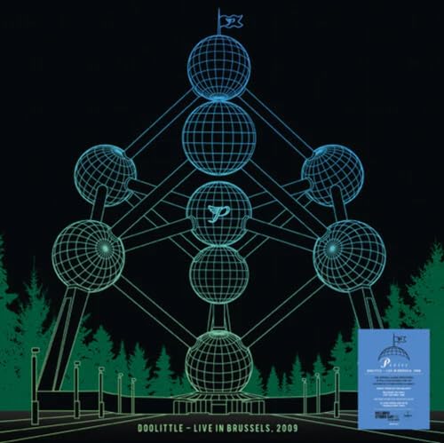Wireframe Ferris wheel with a "P" logo, dark background, and green trees.
