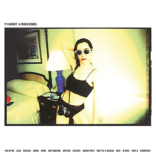 Vinyl record with blue label and white sleeve featuring a woman in black lingerie.