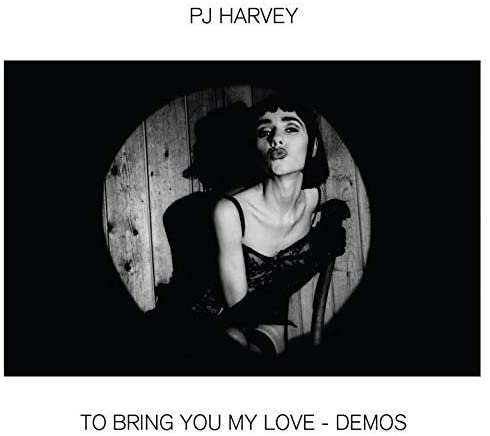 PJ Harvey CD case with disc and cover art featuring a woman in red dress.