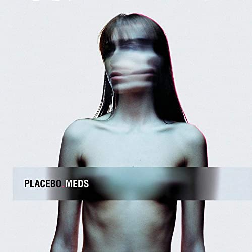 Blurry portrait of a person with long dark hair, album cover for Placebo’s Meds.
