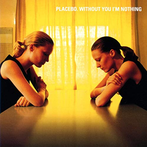 "Album cover featuring two women in black leaning on a table, facing each other."