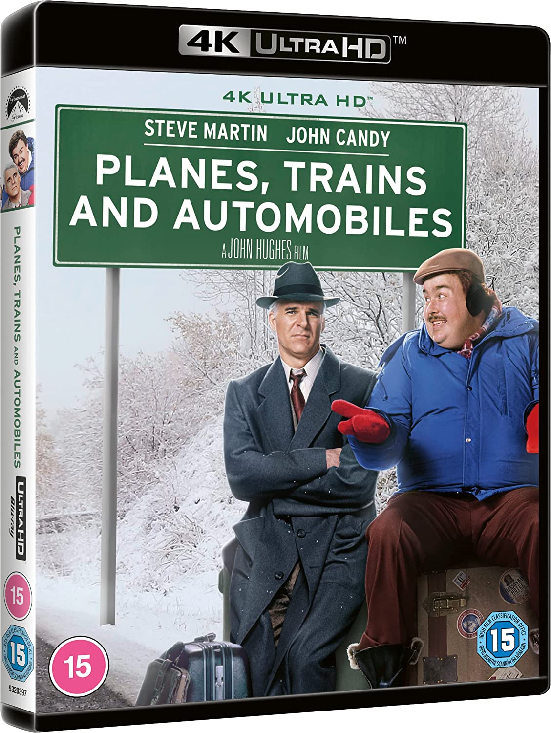 "Back cover of 'Planes, Trains & Automobiles' Blu-ray case with cast images and product details."