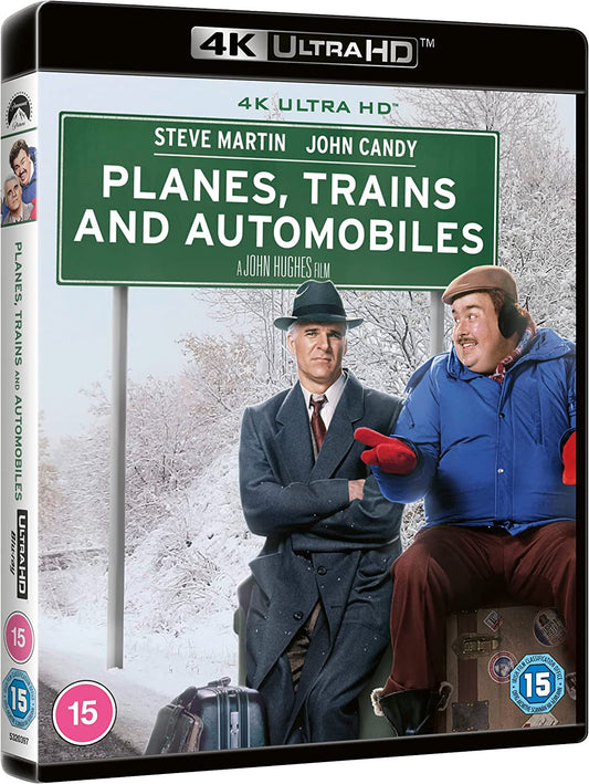 "Back cover of 'Planes, Trains & Automobiles' Blu-ray case with cast images and product details."