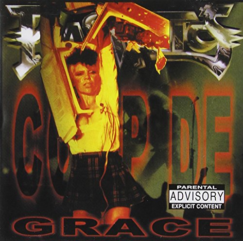 CD cover: Wendy O. Williams with a chainsaw, bold text, orange and black.