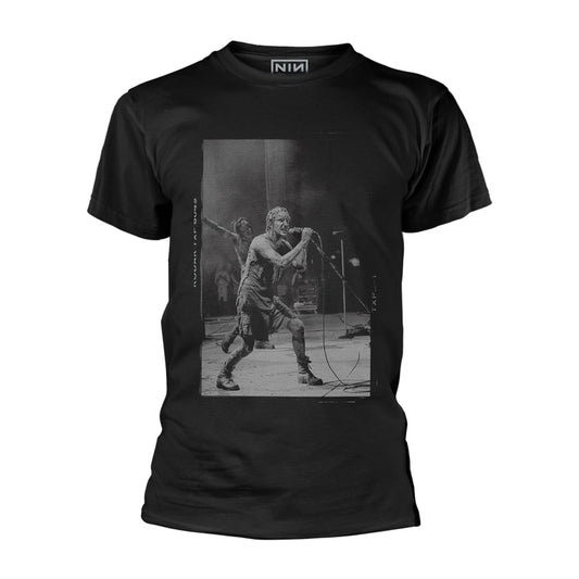Man wearing a black t-shirt with a black and white graphic of a musician.