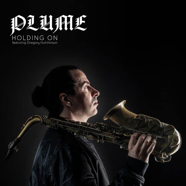 A man in profile holds a saxophone against a dark background with album text.