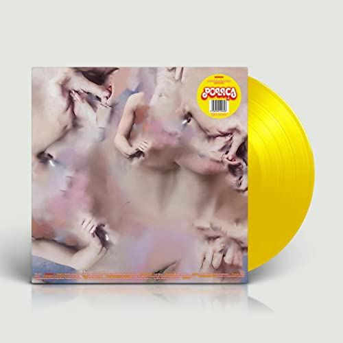 Polica’s “Madness” vinyl record, yellow disc and cover with blurred figures.