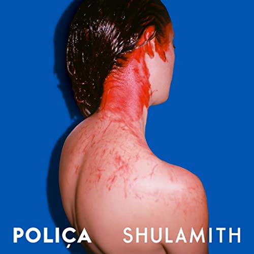 Woman’s back and shoulders with red markings against a blue background.