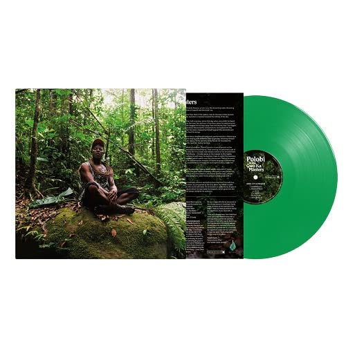 Vinyl record with green disc and album cover featuring a person in a forest.